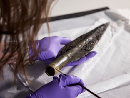 Conservator Bethan Bryan works on the Bronze Age Carnoustie Hoard. Photo © National Museums Scotland (5)