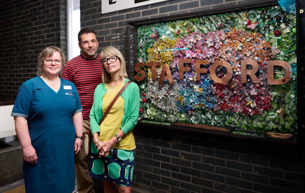 Debbie and John Todd from ProteanArt and Fiona Main next to the Stafford mural
