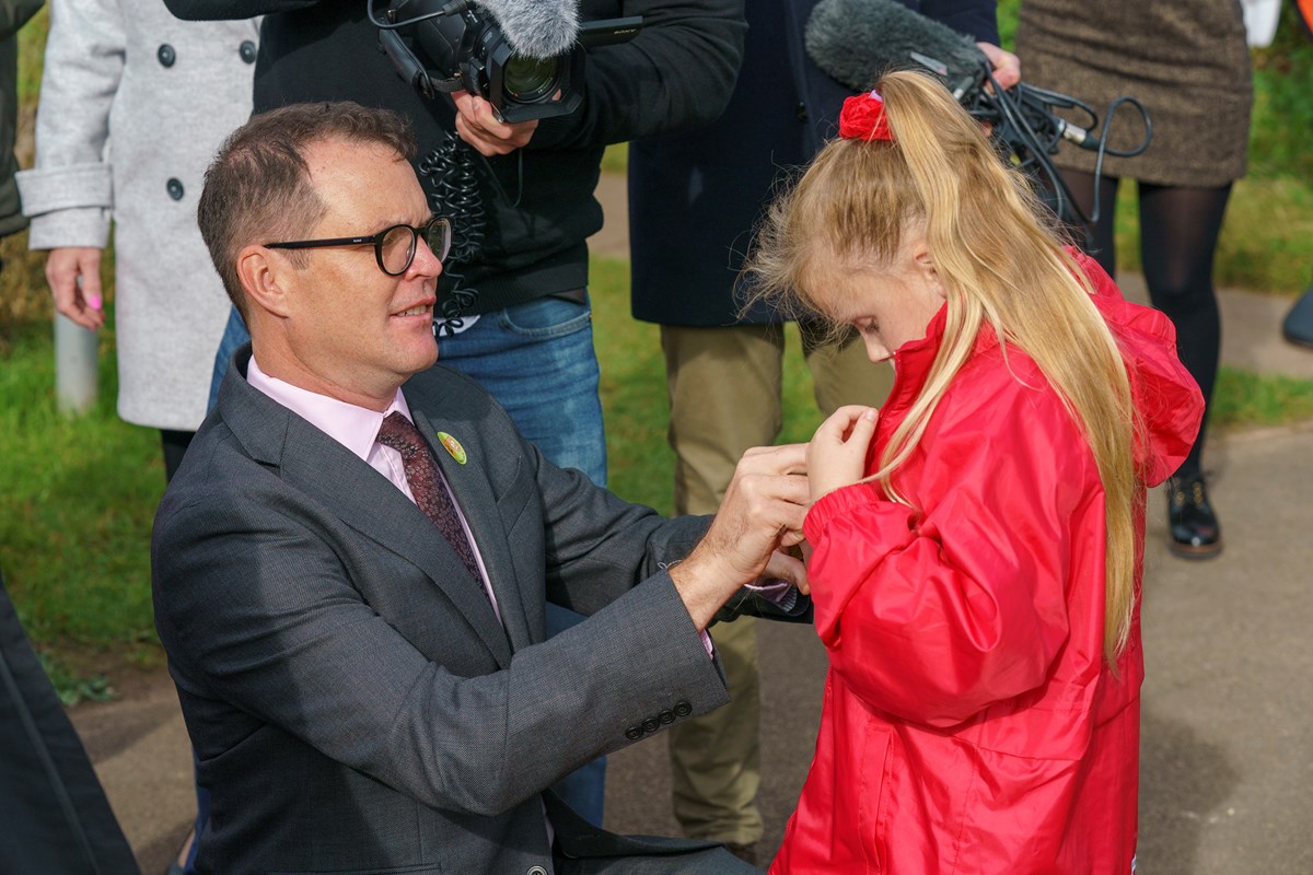 Children receiving their wow tracker badges for walking to school