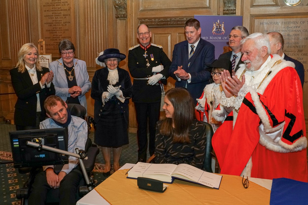 Freedom 7: Civic dignitaries and other VIPs applaud after the signing of a ceremonial book by Rob Burrow's wife Lindsey.