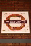 TfL Image - Weaver line roundel at Hackney Downs station: TfL Image - Weaver line roundel at Hackney Downs station