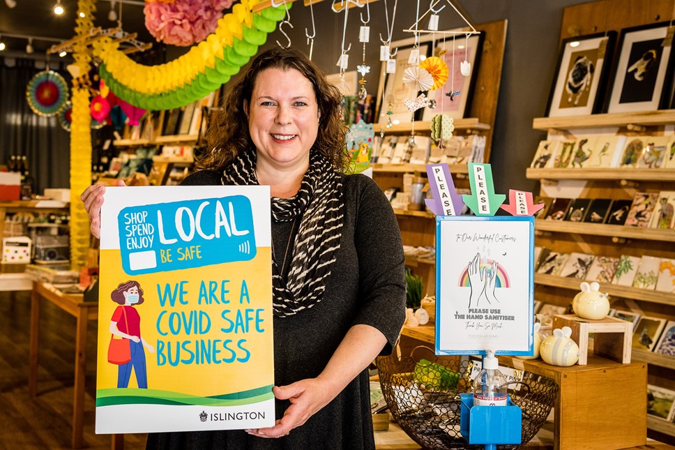 Georgina Black, of Pretty Shiny Shop in Stroud Green Road, Finsbury Park, promoting the Covid-Safe Business Award scheme window stickers