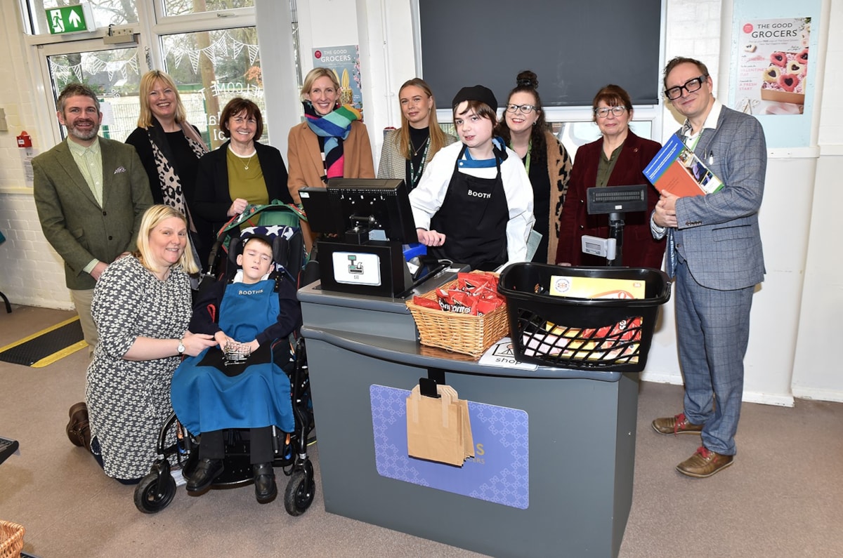 Leader of Lancashire County Council, Phillippa Williamson (3rd from left at the back) and County Councillor Jayne Rear (2nd from right at the back) pictured with Bleasdale School headteacher Sefton Booth (right), staff from the Lancashire Careers Hub and Booths supermarket, and pupils Jack (second left at the front) and Sebastian (front right).