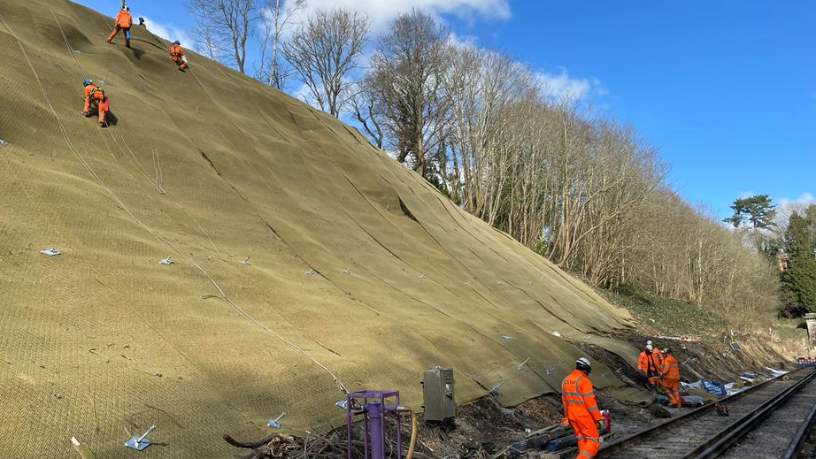 Full steam ahead for Brighton Main Line passengers as Haywards Heath and Balcombe landslips repaired and speed restrictions lifted in Sussex: Haywards Heath and Balcombe track mesh and sky