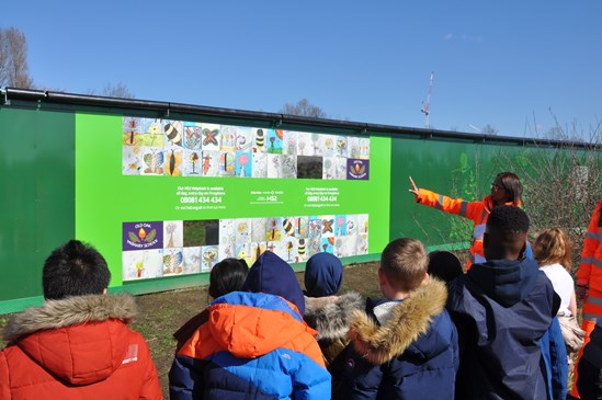 Pupils from Old Oak Primary School name mini HS2 Tunnel Boring Machine ‘Bramble’: Pupils from Old Oak Primary School visit new hoardings they designed at Wormwood Scrubs