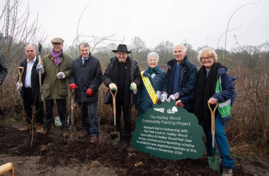 Hadley Wood-4: Hedge laying at Hadley Wood with (L to R) MP Bambos Charalambous, Tree Council chair Joel Cadbury, John Varley, Network Rail chair Lord Hendy of Richmond Hill, Hadley Wood Rail User Group's Francesca Caine, Hadley Wood Association chairman Robert Wilson and Tree Council chief executive Sara Lom.