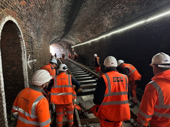 Inside Ryde Tunnel - Engineers inside Ryde Tunnel, where flood water can often reach the roof. Drainage improvements will mean that flood water can drain much quicker, preventing prolonged disruption.