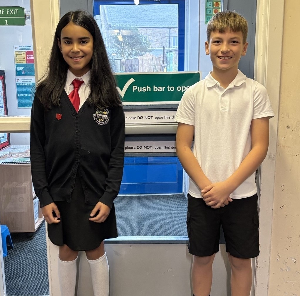 Maya and Ruaridh from P7 welcome guests to Dunlop Primary