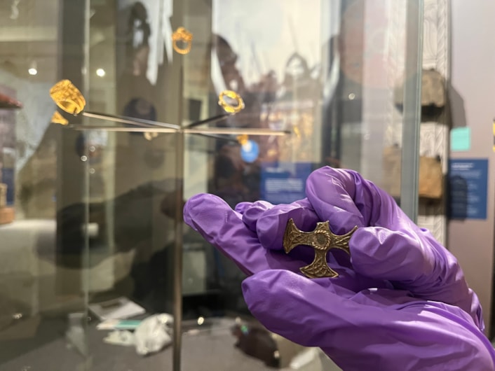 Saxon cross display: Believed to have once been a prestigious badge of office and a sign of religious identity, the silver, gilded pendant was discovered by a metal detectorist, with one of its four arms broken, and its central stone missing.

The newly created drawings, penned by archaeological illustrator John Prudhoe, show how the complete cross could have looked with its thin layer of gold leaf shining and a beautiful central garnet.