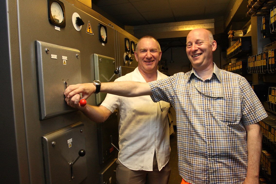 Nottingham resignalling: Trent Power Signal Box is switched out: Nottingham resignalling: Signals and telecoms engineer Peter Short and resignalling programme manager Dave Scarth pull the lever to switch off the panel and turn off the box.