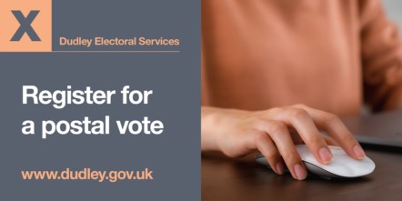 image of a hand on a mouse registering for a postal vote