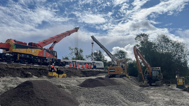 Network Rail and Southern Railway confirm 1 September planned reopening of Haywards Heath to Lewes line: The first carriage that overturned following the derailment of a train near Lewes on Thursday 13 August is lifted upright-2