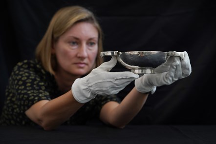 Curator Lyndsay McGill with a quaich, silver, by Matthew Colquhoun, Ayr, c1685 © Stewart Attwood