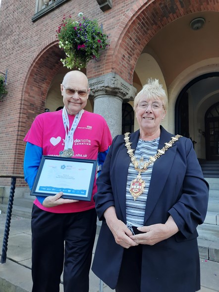 mayor with transplant games gold medal winner