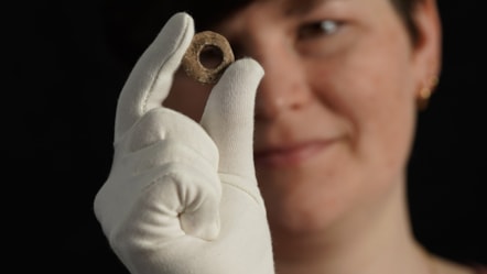 Janel Fontaine, Treasure Trove Officer, with the Medieval spindle whorl. Photo (c) Stewart Attwood. (4)