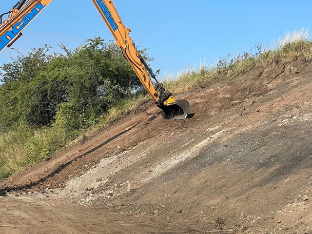 Cutting benches into banking: Embankments are being reprofiled and upgraded to support double tracking of Levenmouth Rail link