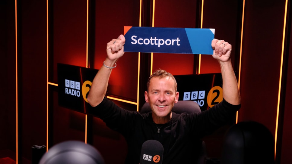 Scott Mills holding his Scottport sign. Copywright: BBC Radio 2