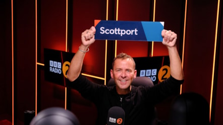 Scott Mills holding his Scottport sign. Copywright: BBC Radio 2