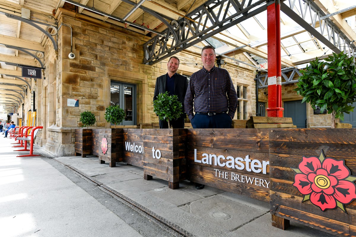 (L - R): Phil Simpson (Director, Lancaster Brewery); Michael Byrne (Avanti West Coast Station Manager at Lancaster)