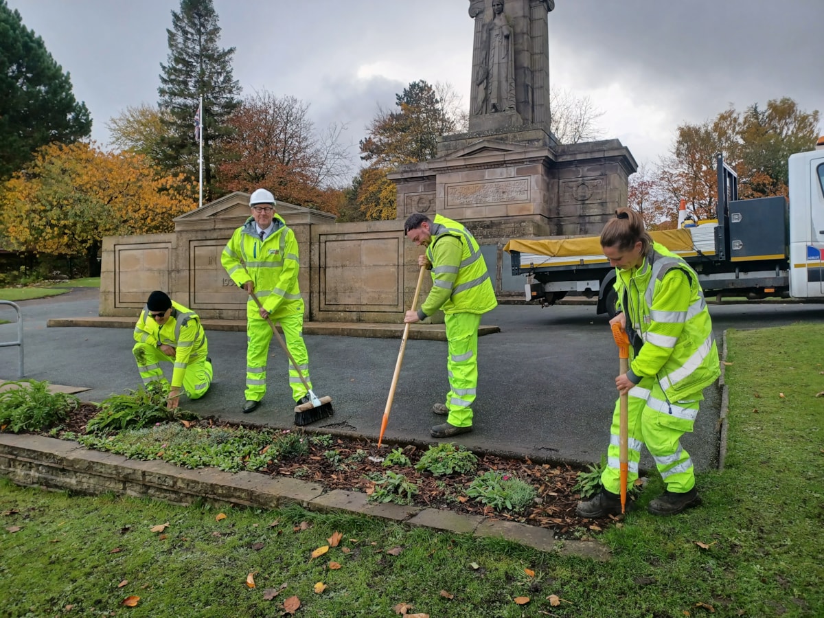 Cllr Warren Goldsworthy and LCC staff at Accrington War Memorial in Oak Hill Park
