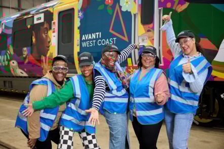 Baraka Carberry (second left) created vibrant artwork based on themes and ideas from colleagues at Avanti West Coast for Together We Roll train wrap.