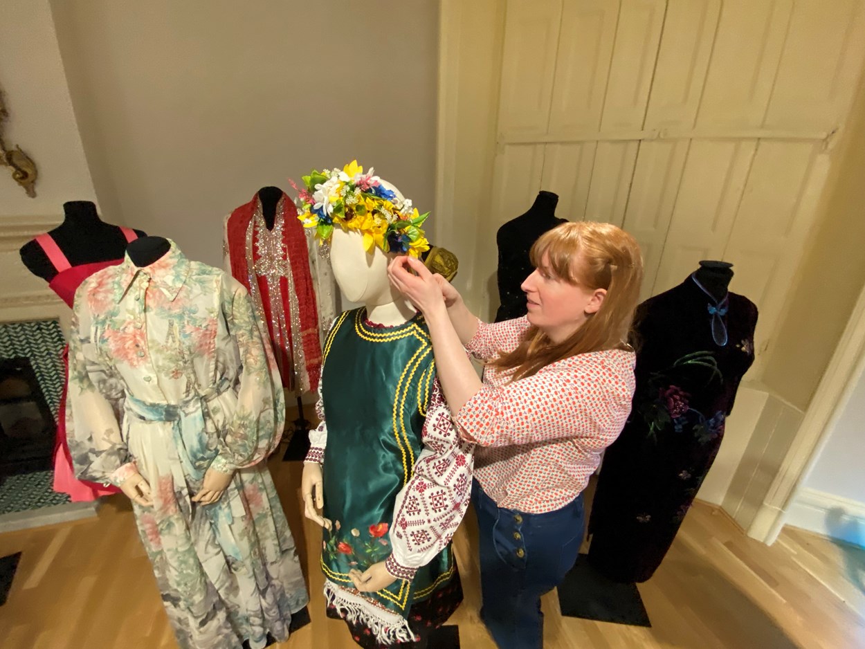 Ukrainian dress loan: Curator Natalie Raw works on the Ukrainian dress in the fashion gallery at Lotherton. From the central region of Ukraine, the costume consists of an embroidered shirt called a Vyshyvanka, which is worn along with a Vynok headdress and a sleeveless jacket called a Korstka.