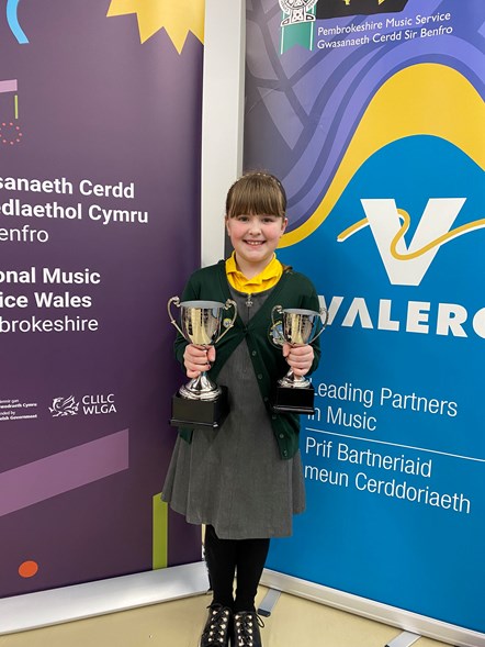 violinist Alice Thomas of St Oswalds School with her two music trophies
