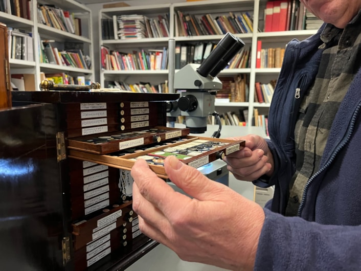 Microscope slides: Volunteer Stephen Crabtree uses a microscope to study the slides at the Leeds Discovery Centre.
Stored in small, wooden trays, the collection is thousands strong and is being painstakingly reviewed as part of a volunteer project.