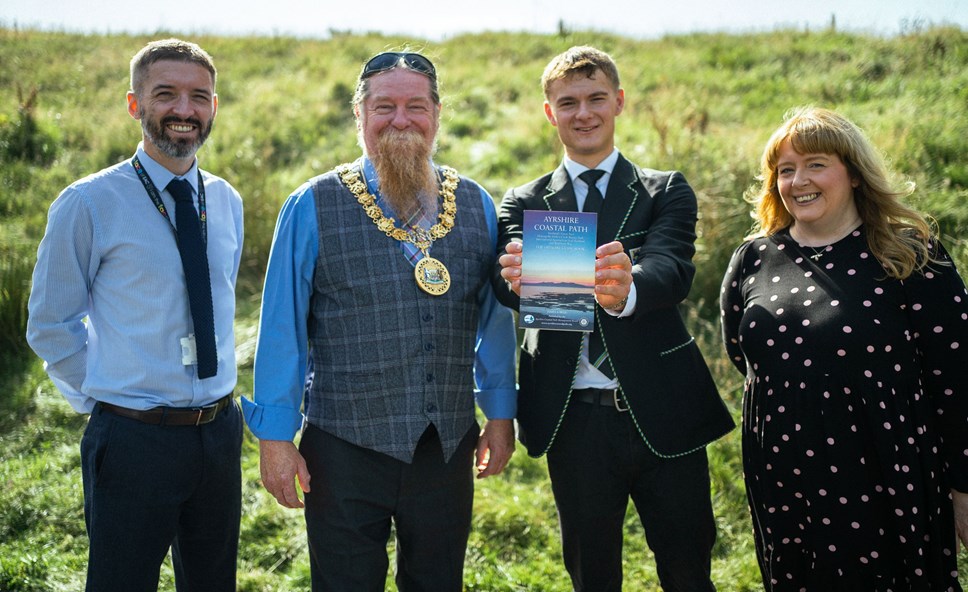 DH Mr Johnston with Provost Todd, Kyle from Stewarton Academy and Cllr Elaine Cowan with the Ayrshire Coastal Path guidebook