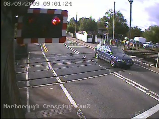Motorist ignores warning lights at Narborough level crossing, Leicester: Motorist ignores warning lights at Narborough level crossing, Leicester