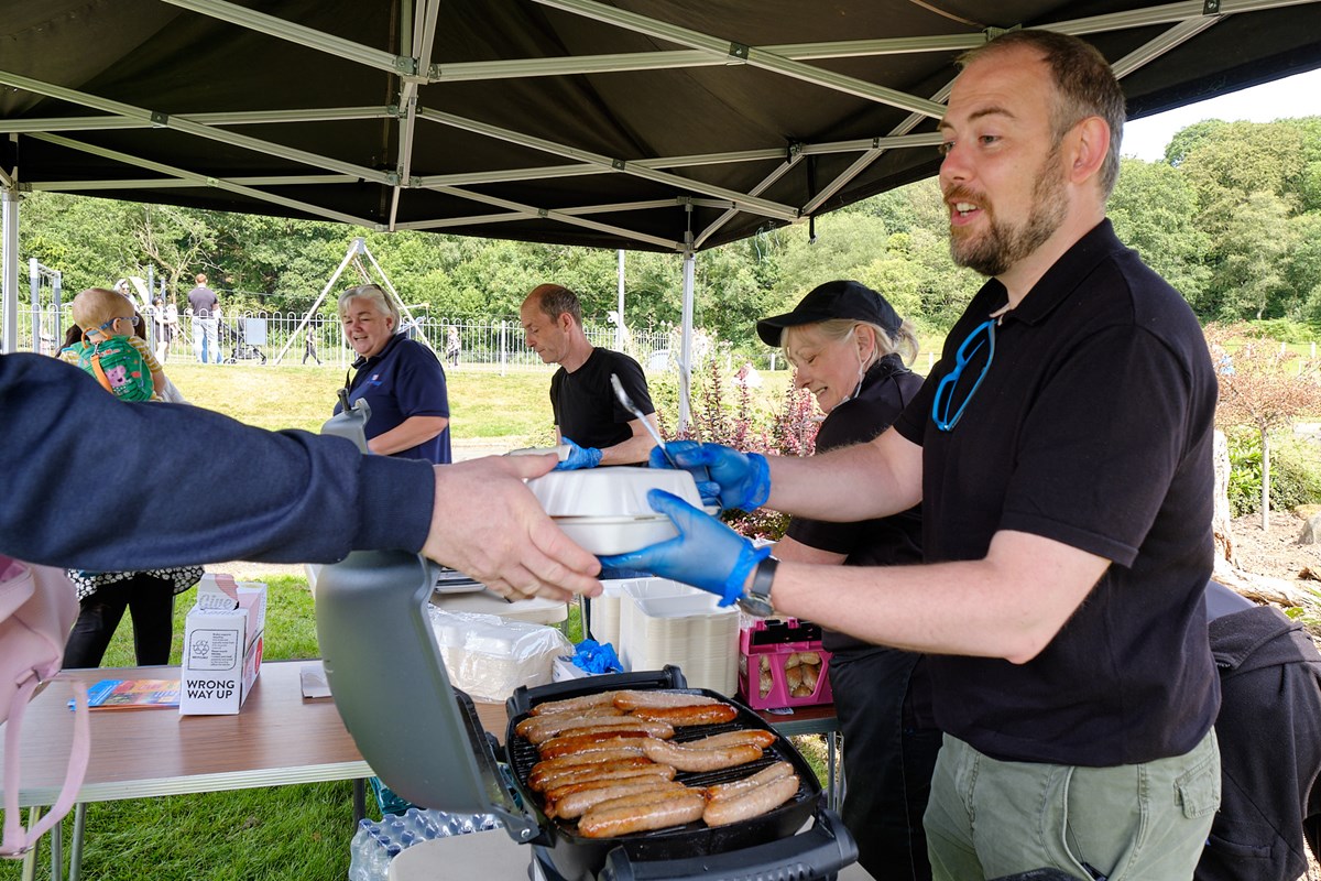Cllrs Ingram and Watts lend a hand to the Catering Services BBQ team