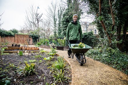 A volunteer working at the Highbury Quadrant community garden
