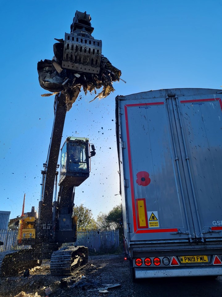Grabber picking up fly-tipping at Wango lane