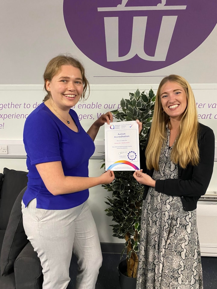 Waterloo Station Manager Emily Haggard and Laura Kopelciw, Project Manager for Stations, with the Autism Friendly Accreditation certificate