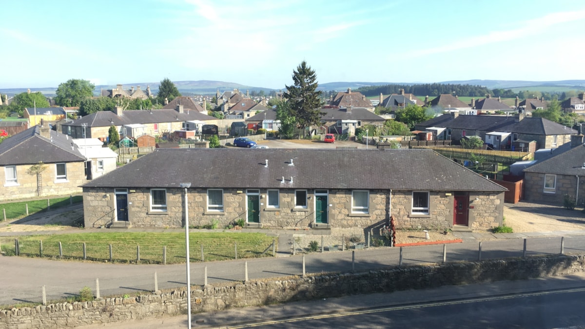 A row of council housing in Elgin - stock image.