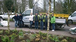 Working alongside volunteers from the hospice, the team spent the day planting bulbs for the spring and reviving the gardens that surround the hospice.: Working alongside volunteers from the hospice, the team spent the day planting bulbs for the spring and reviving the gardens that surround the hospice.