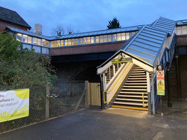 Bromborough station footbridge entrance from platform at dusk
