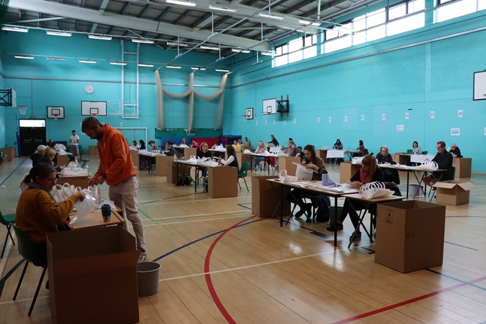 Carr Manor PPE project: Volunteers in the school hall at Carr Manor Community School making vital PPE for health workers.