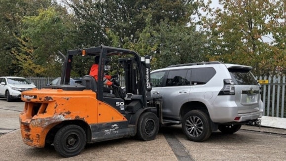 Car on forklift cropped