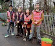 SWR Sustainability team at Raynes Park station.: SWR Sustainability team completing biodiversity enhancement work at Raynes Park station.