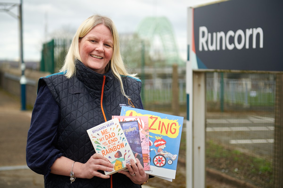 Rachel Jones, Diversity and Inclusion Consultant at Avanti West Coast, with a selection of books donated to local schools