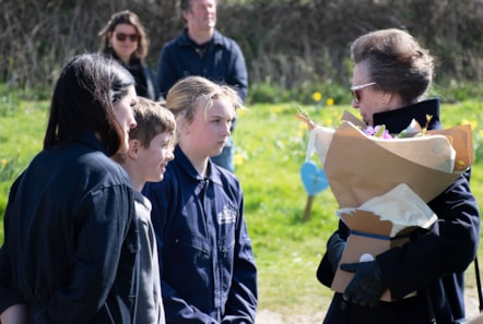 Erin and Jack from Pembroke Dock Community School present HRH Princess Royal with local gifts