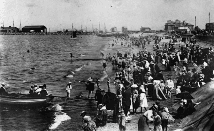 West End beach, Morecambe, with a view of Morecambe harbour and the old Midland Hotel in the distance. Taken circa 1910.