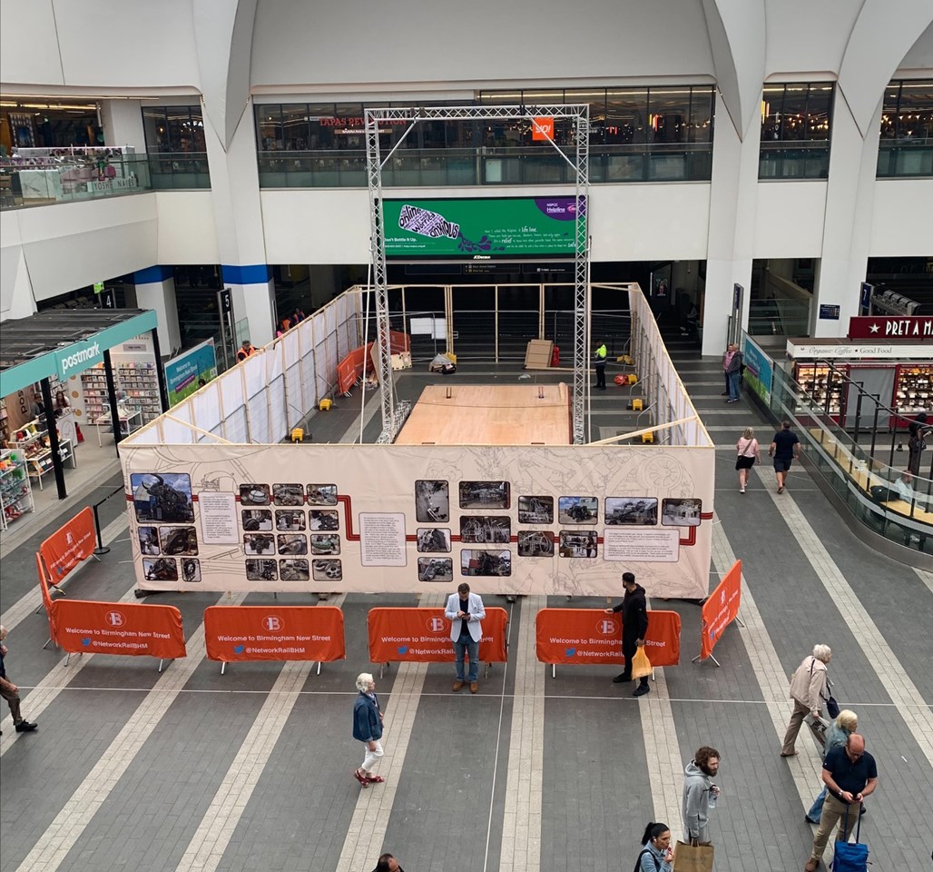 Shot looking down onto concourse of Ozzy hoardings