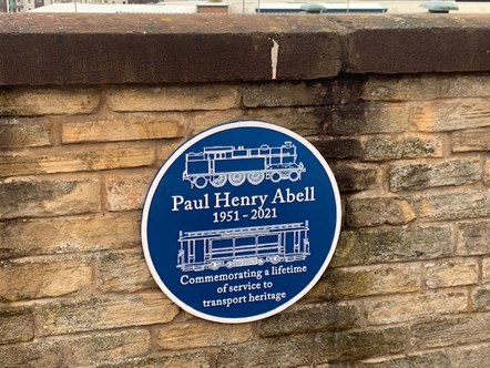 The blue plaque at Ashburys station commemrating Paul Abell