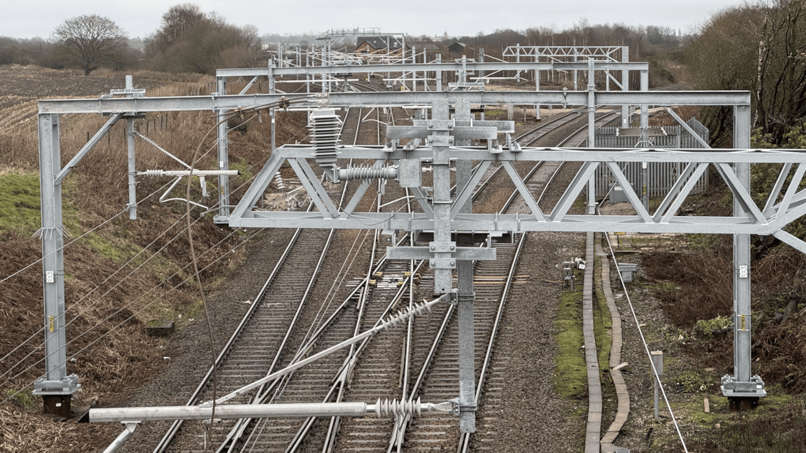 New overhead line stanchions and cables on Wigan to Bolton route Jan 1 2025