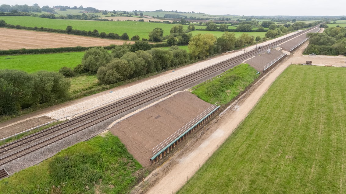 Orange army use cost-saving Japanese method to stabilise railway: Bridge Farm ground works aerial view. Aylesbury.