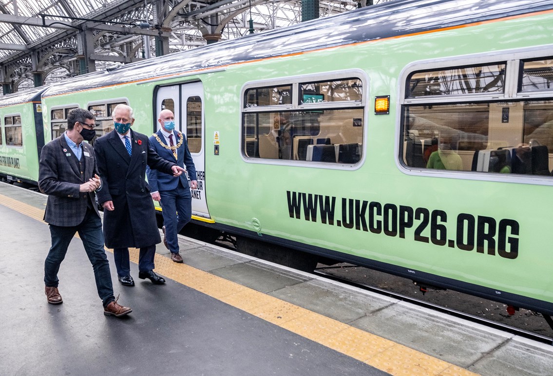 HRH The Prince of Wales steps aboard Britain’s green trains of the future in Glasgow during COP26: HRH Prince Charles with Martin Frobisher of Network Rail and Glasgow Lord Provost Philip Braat