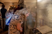 Visitor viewing the only surviving issue of the 1216 Manga Carta up close in Durham Cathedral Museum
