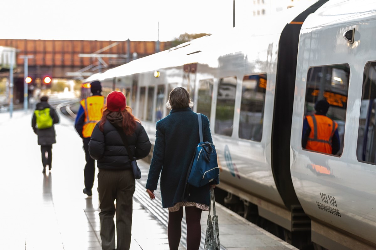 Image shows two customers boarding a Northern train